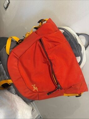 Arc'teryx Red Backpack with Yellow Accents